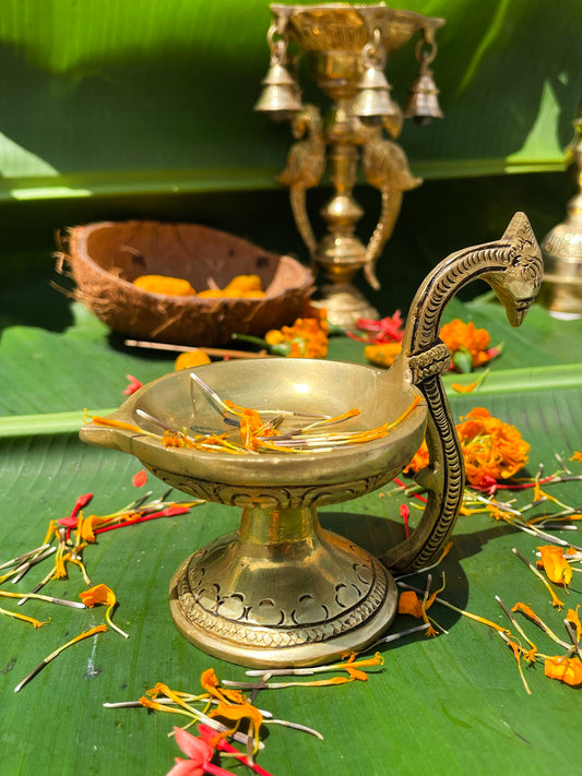 Ananta Deepam – Handcrafted Brass Oil Lamp with Ornate Curved Handle